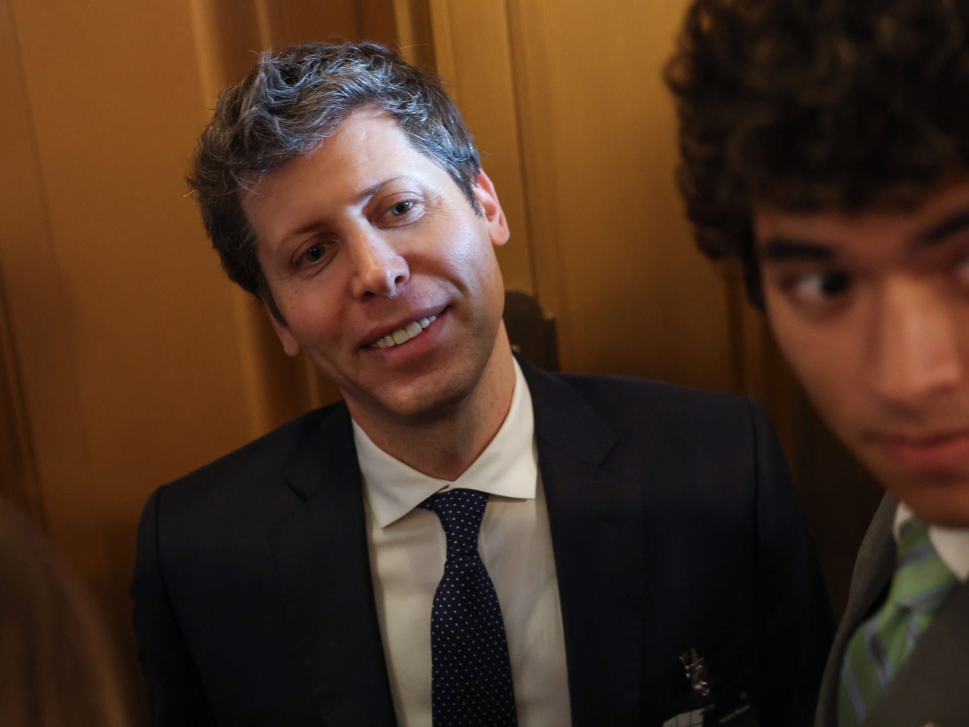 OpenAI CEO Sam Altman leaving a Capitol meeting